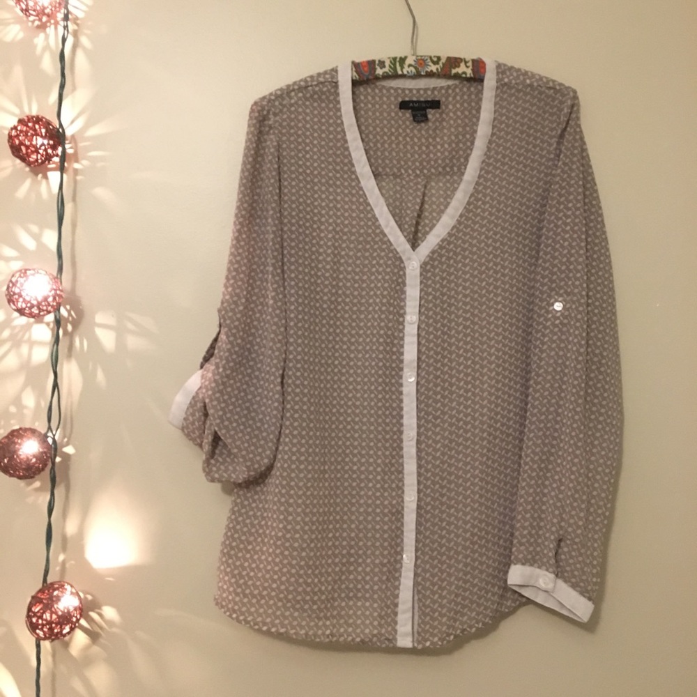 Sheer top, roll sleeves or let down. Work or out.